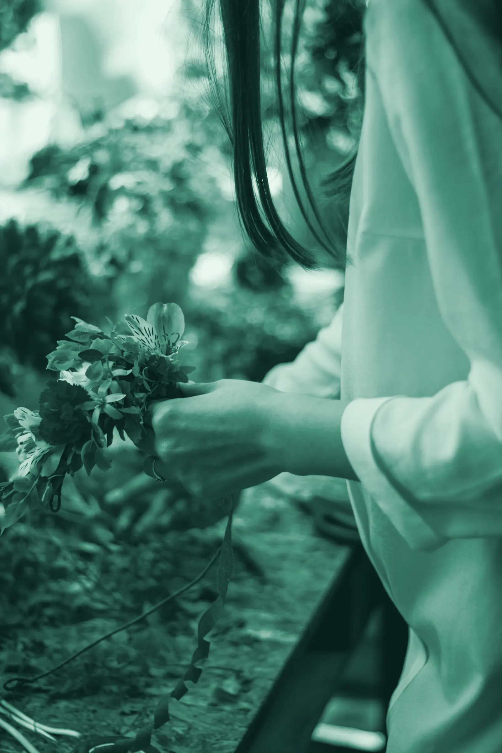 Illustrative photo: a florist arranging fresh flowers on her workbench.